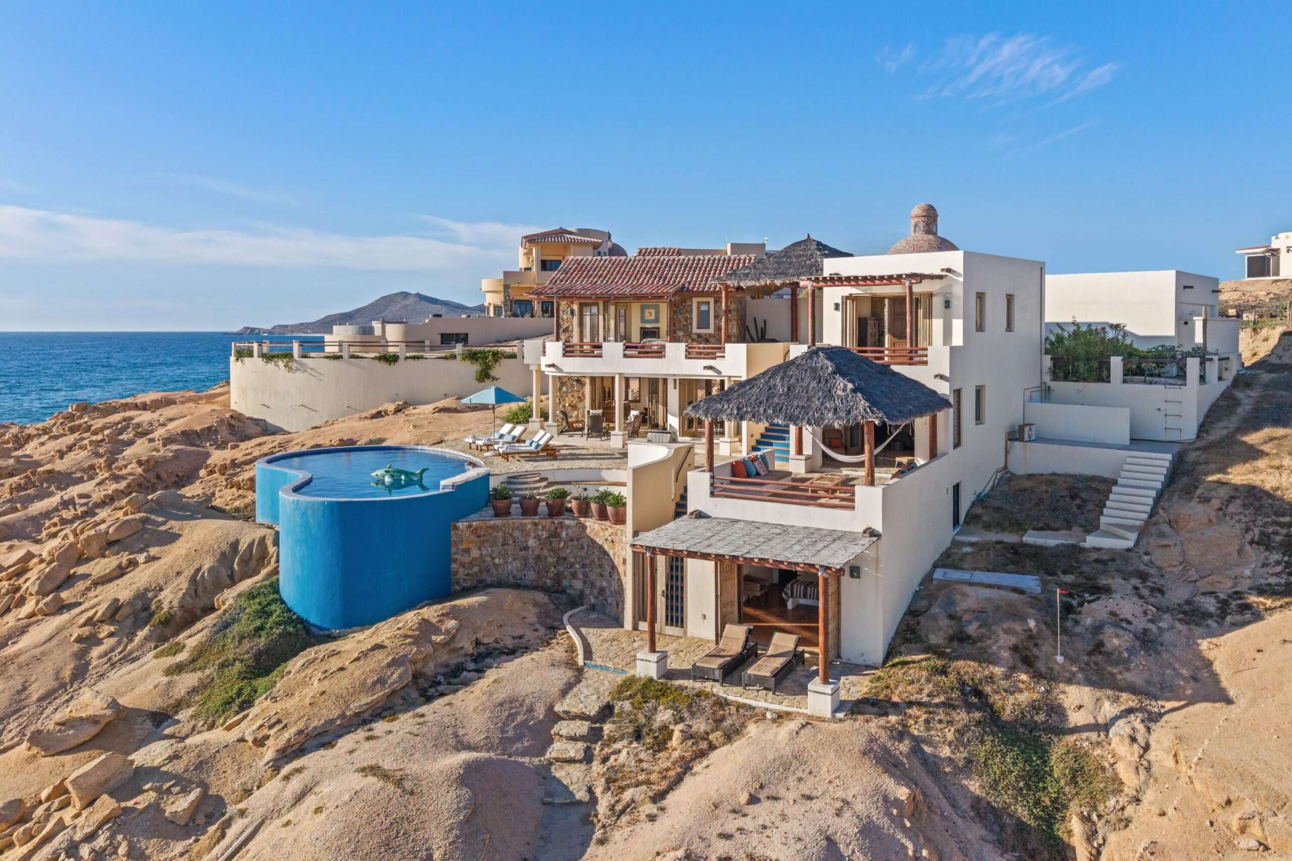 Los Cabos Los Valles Sophisticated and solidly built, this 5,588 sq.ft. estate in Club Campestre offers luxury living with exceptional construction quality rarely found in Los Cabos. Residents enjoy exclusive access to a private beach club and world-class golf course, all just minutes from San Jose vibrant dining and culture. The home features 4 ensuite bedrooms, a 3-stop elevator, and a Generac backup system. Entertain in style with a chef's kitchen, wine room with Tzalam wood cabinetry, and an outdoor BBQ area with fire pit. Relax by the heated pool or on the Jacuzzi terrace with partial ocean for sale