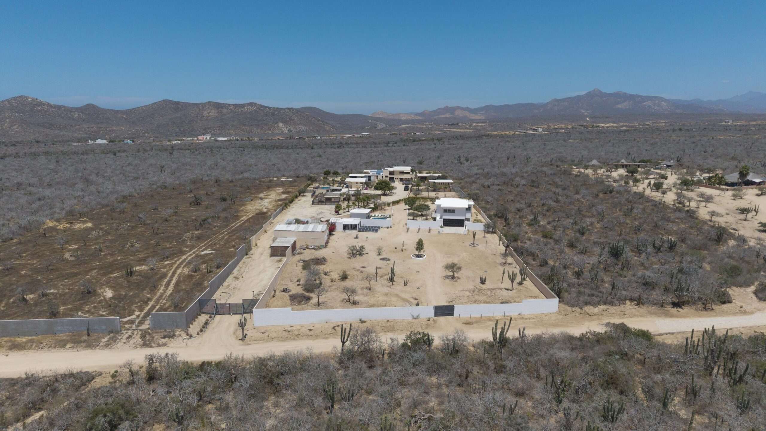 Los Cabos El Tule-Inland:General Rare investor opportunity in the San José Corridor. 2 luxury residences fully completed and move-in ready. 8 additional units with land secured and full blueprints in place -- ready to build to buyer's vision. At for sale