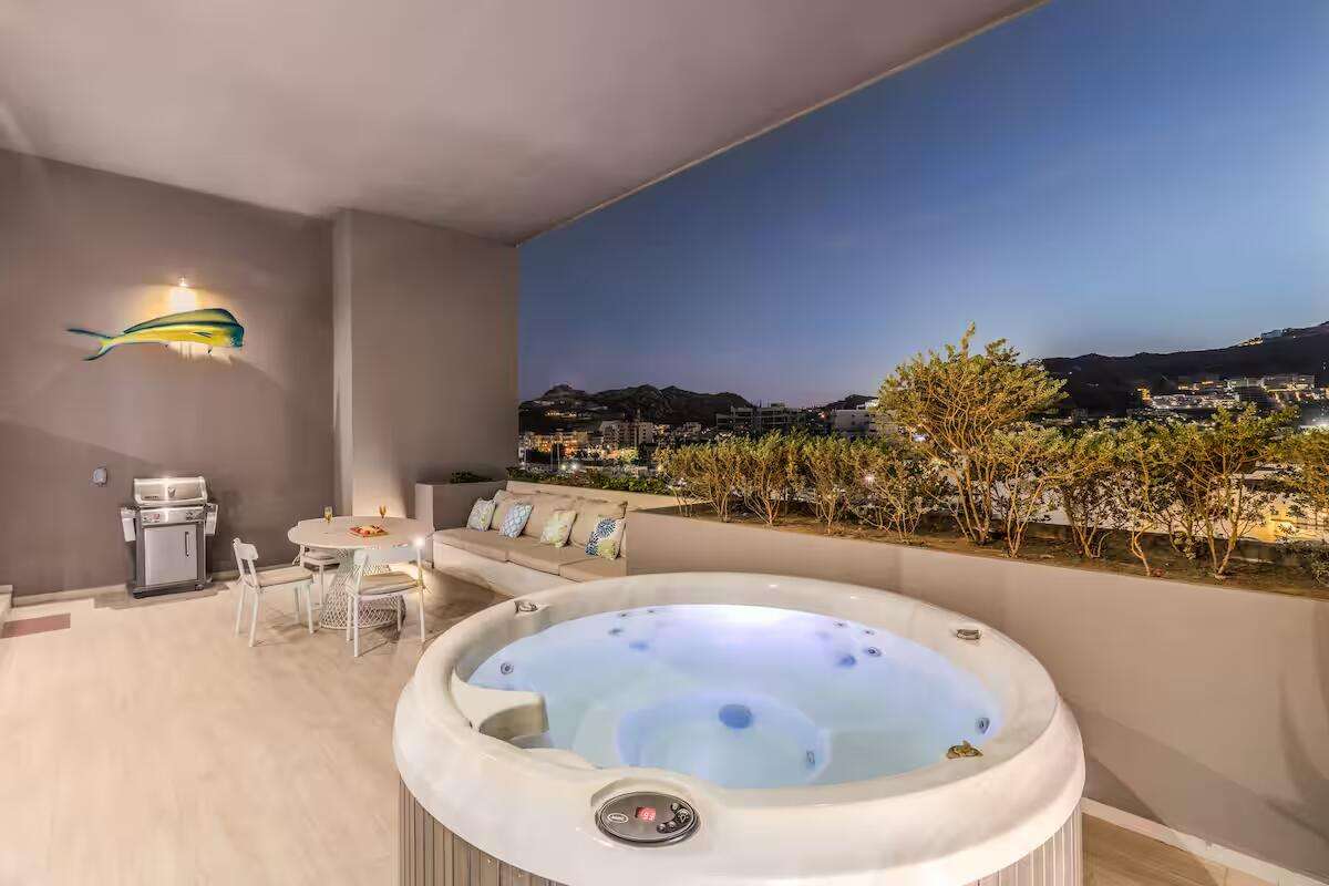 Los Cabos The Paraiso Residences Experience the best location and the luxury with Condo Marina Vista, located at The Paraiso Residences, this modern 2BR/2BA condo is just steps from the world famous Cabo San Lucas Marina, putting you in the heart of the action. Delight yourself with the impressive private terrace, with jacuzzi, grill and much more. With its new and modern taste, Condo Marina Vista is your best option for your second home or investment in Cabo. This condo features modern decor in perfectly lit spaces, fully equipped kitchen with everything you will need, including electric stove, dishwasher, oven, microwave, etc. A spacious and fun living room perfect for entertaining and relaxing, with a comfortable sofa that can make extra sleeping space for one more guest. Two large bedrooms with King size beds and bathroom with shower, both with ample wardrobe space, TV and luxury bedding. The living room is spacious and perfect for entertaining, with a comfortable sofa that can function as an additional sleeping space for one or two more children.Wait until you come out! First open the pocket doors from the living room to the master bedroom to extend your area to the outside terrace with jacuzzi, barbecue and dining for six. Enjoy the huge spacious terrace and its magnificent – Paraiso Residences, Cabo San Lucas, BS