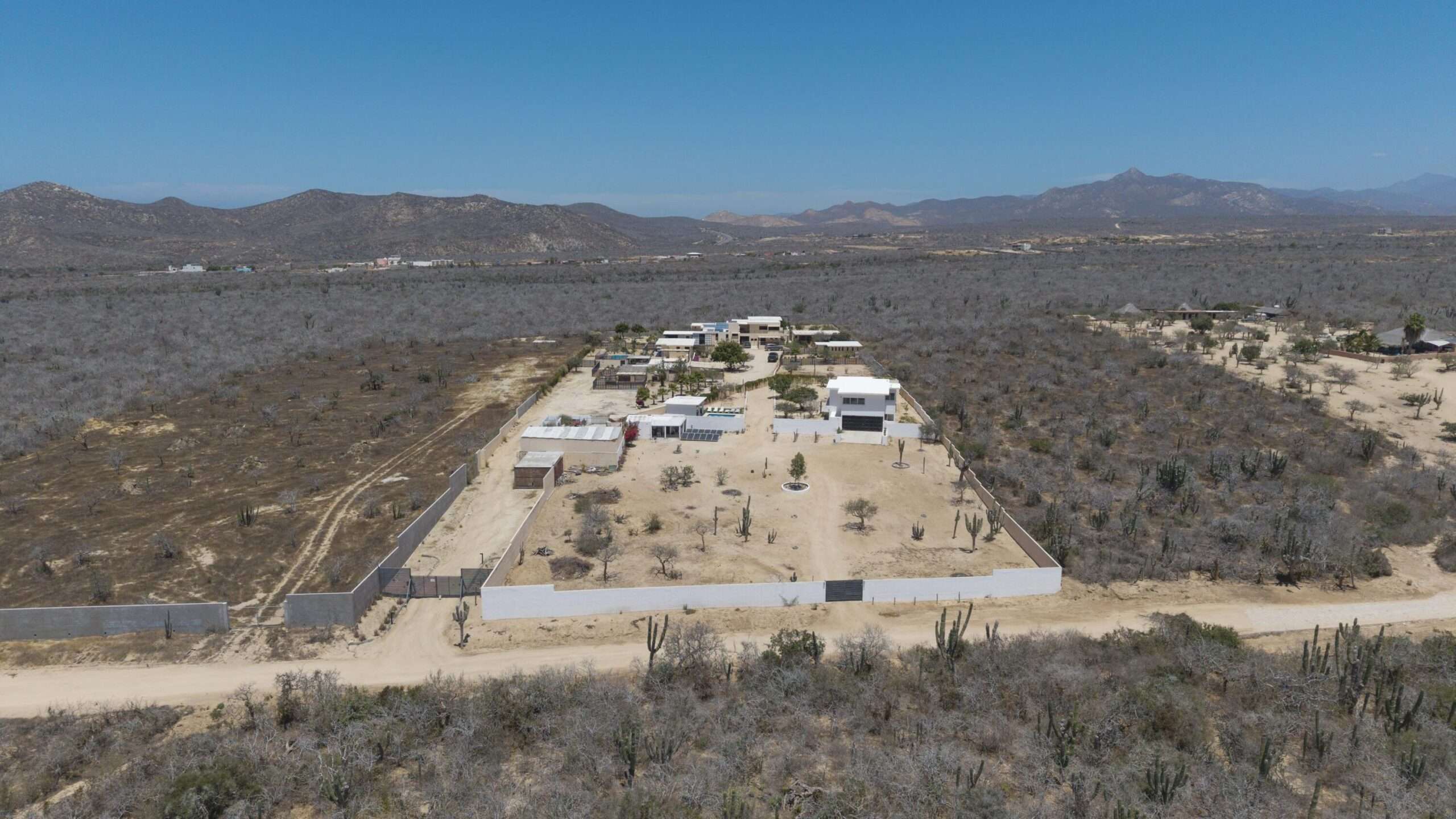 Los Cabos El Tule-Inland:General Rare investor opportunity in the San José Corridor. 2 luxury residences fully completed and move-in ready. 8 additional units with land secured and full blueprints in place -- ready to build to buyer's vision. At – 2-C Cerro del Vigia, Cabo San Lucas, BS