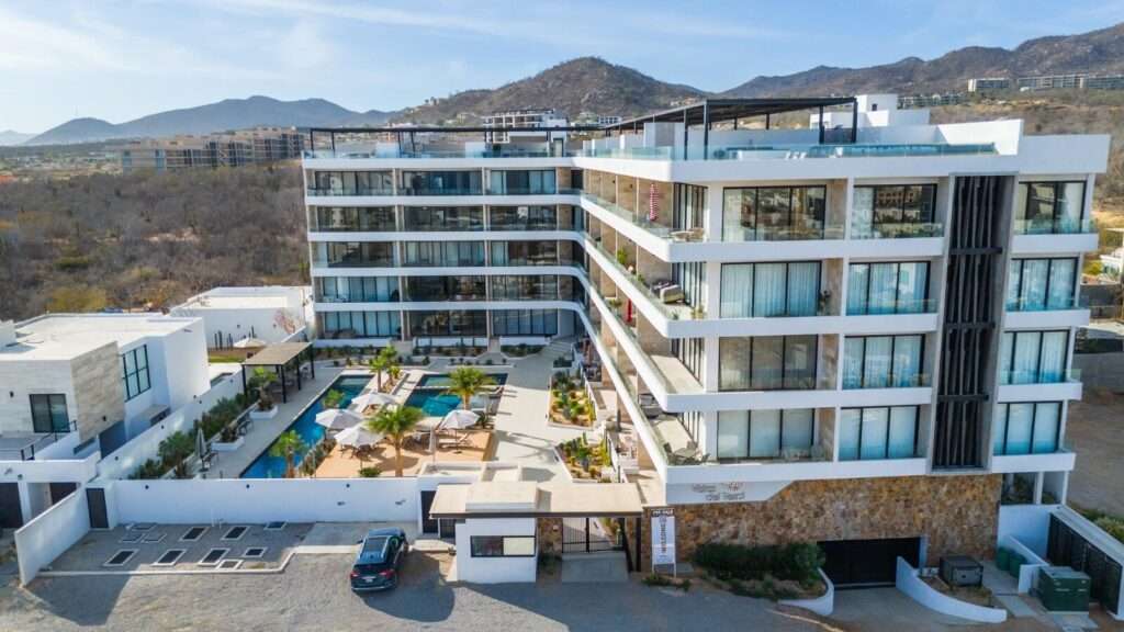 Los Cabos Marea Los Cabos Pelicano 402 is a turnkey 2-bedroom, 2-bathroom residence, fully furnished and move-in ready. Its open-concept layout seamlessly connects the living, dining, and kitchen areas to a spacious continuous terrace, also accessible from both bedrooms, creating effortless indoor-outdoor living. Designed to maximize privacy, natural light, and functionality, this home offers a peaceful and inviting atmosphere. Ideal as a full-time residence, vacation home, or investment property, it combines quality craftsmanship, contemporary finishes, and the added confidence of buying directly from the developer. – Monte Rocella, Cabo Corridor, Cabo Corridor, BS