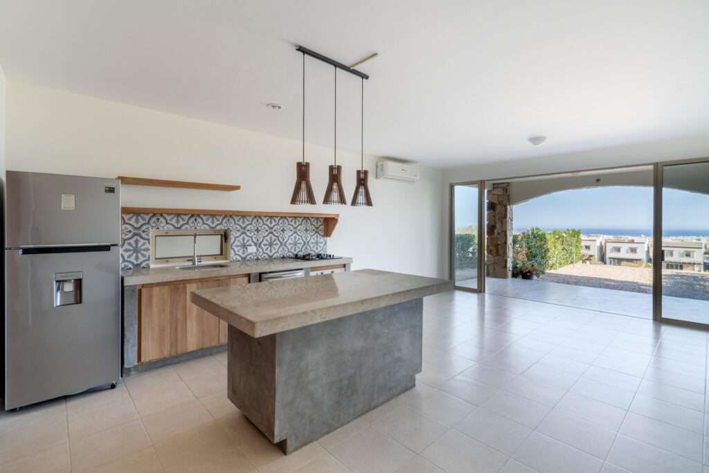 Los Cabos Santa Rita This charming townhome is located in a secluded enclave of eight in the exclusive neighborhood known as Pedregal de Cabo San Lucas just steps to town. This 2 bedroom 2.5 bathroom offers private access through an electric gate and a carport with a pergola. As well as a pool and BBQ available for residents. Beautiful top of the line finishes throughout. With an open concept layout, balconies in each bedroom, an open courtyard, walk-in closet, marble and granite counters add to the charm of this spacious townhome. Residents enjoy the local amenities redefining the Cabo lifestyle and to the most discerning individuals who call this their home away from home. From beach access where the sparkling waters of the Pacific Ocean contrast the sunset where you can watch the seasonal whales and turtle release, to a gym & spa offering treatments and a relaxation experience. Residents have exclusive access to establishments offering exquisite cuisine, The courts cafe offering breakfast & lunch as well as Fenix Restaurant offering day and night service. As well, in the heart of the development, with mountain – Pedregal de Cabo San Lucas, Cabo San Lucas, BS