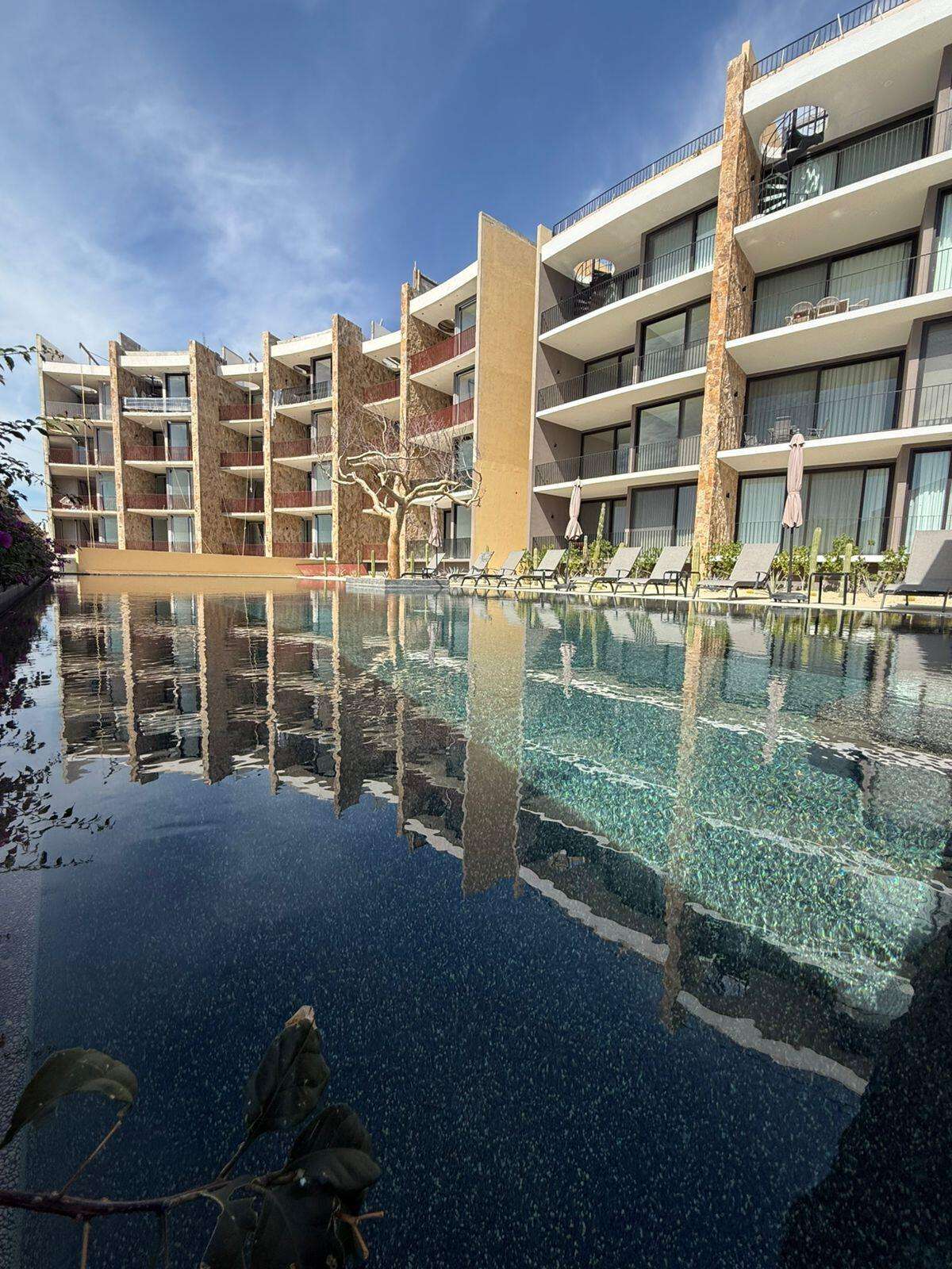 Los Cabos Marea Los Cabos Pelicano 402 is a turnkey 2-bedroom, 2-bathroom residence, fully furnished and move-in ready. Its open-concept layout seamlessly connects the living, dining, and kitchen areas to a spacious continuous terrace, also accessible from both bedrooms, creating effortless indoor-outdoor living. Designed to maximize privacy, natural light, and functionality, this home offers a peaceful and inviting atmosphere. Ideal as a full-time residence, vacation home, or investment property, it combines quality craftsmanship, contemporary finishes, and the added confidence of buying directly from the developer. for sale