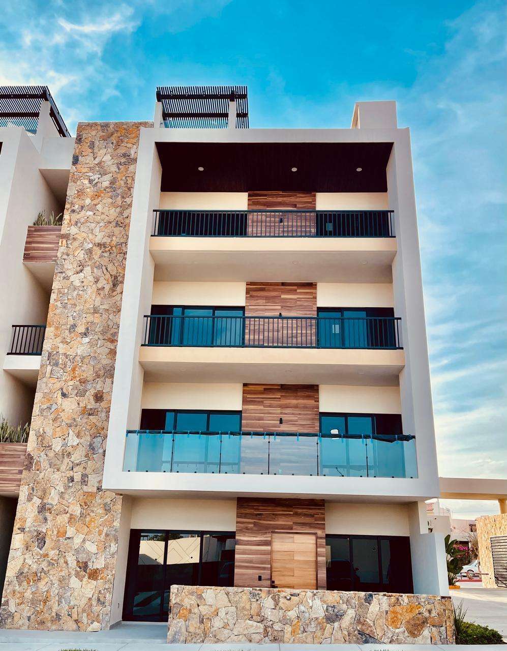 Los Cabos Brisas Del Tezal Ready for immediate delivery! Beautiful ground-floor 2BR/2BA condo in Brisas del Tezal, an exclusive low-density community of only 36 residences in two 4-story elevator buildings. Just minutes from Medano Beach, downtown Cabo, shopping, golf, and restaurants. Features premium finishes including marble floors, granite countertops, parota wood carpentry, floor-to-ceiling marble showers, pantry, laundry room, wall-to-wall closets, mini-split A/C throughout, and a spacious terrace. No adjoining side neighbors for exceptional privacy. Resort-style amenities include a heated pool, clubhouse, coworking space with Wi-Fi, BBQ area, playground, landscaped grounds, 24/7 security, and immediate occupancy. Ideal for full-time living, vacation use, or investment. for sale